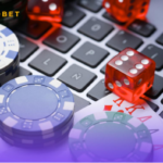 An image of playing chips, cards, and dice on a keyboard