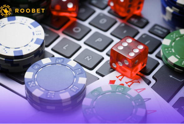 An image of playing chips, cards, and dice on a keyboard