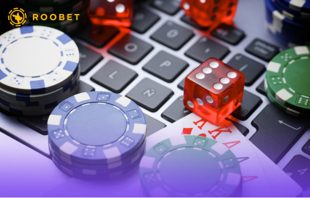 An image of playing chips, cards, and dice on a keyboard
